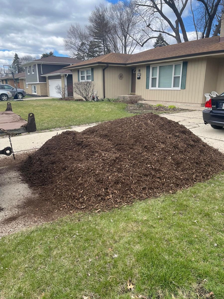 Load of mulch dropped on a driveway ready to spread in Rockford, IL