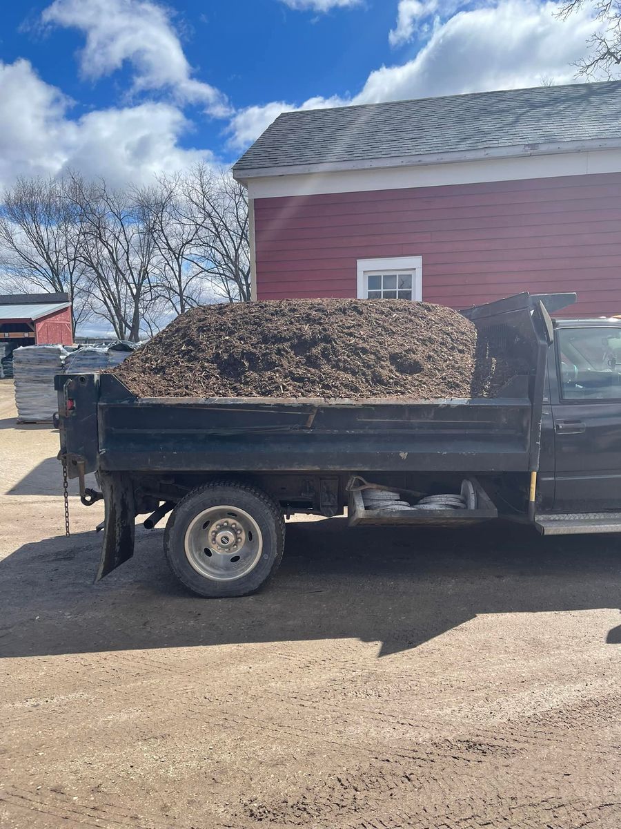 Dump truck loaded with mulch for a Rockford, IL installation