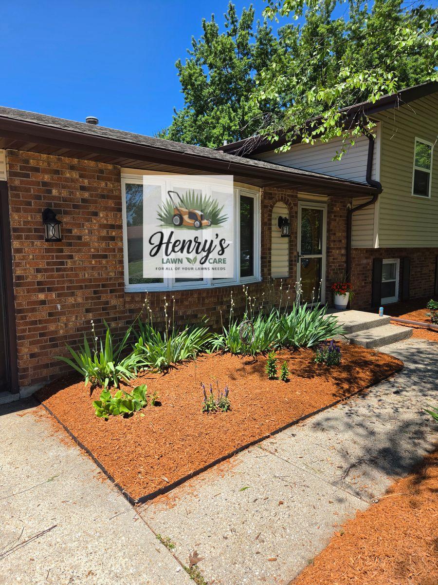 Freshly mulched garden bed along a front walkway in Rockford, IL
